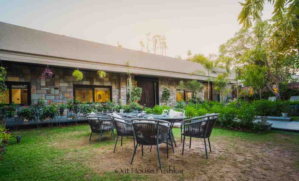 Garden seating area at OutHouse Pushkar